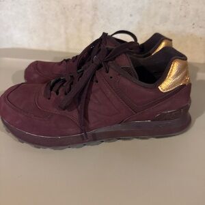 New Balance Women's Burgundy Sneakers with Gold Heel Accent